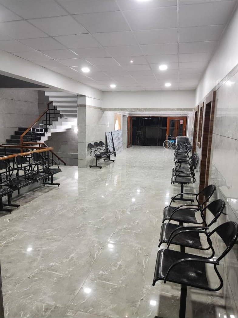 Corridor with waiting chairs and staircase on an upper floor