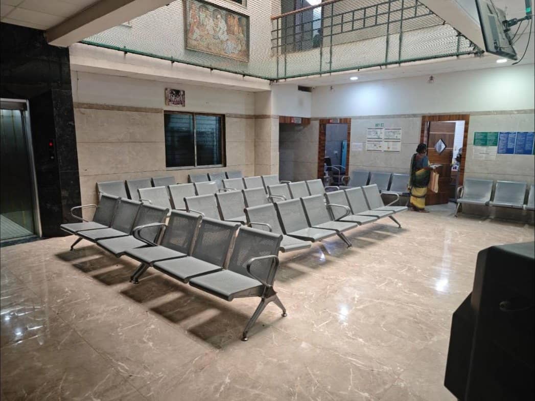 Waiting area with rows of seating near the lift