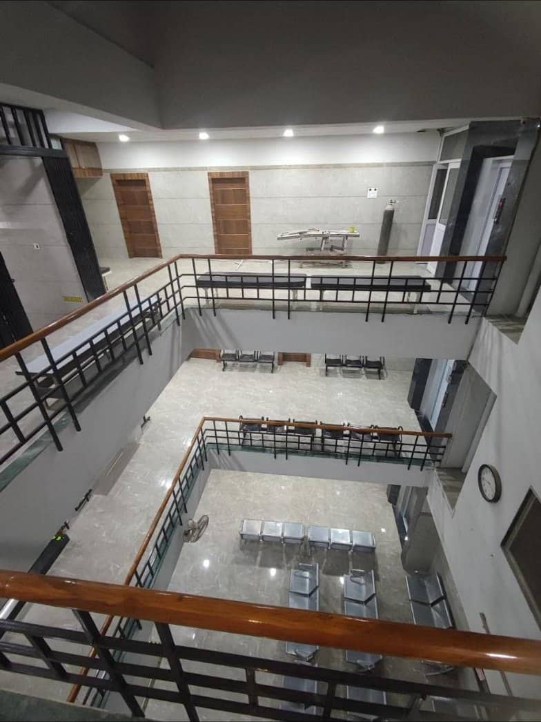 Central atrium and waiting areas inside Narmada Multispeciality Hospital